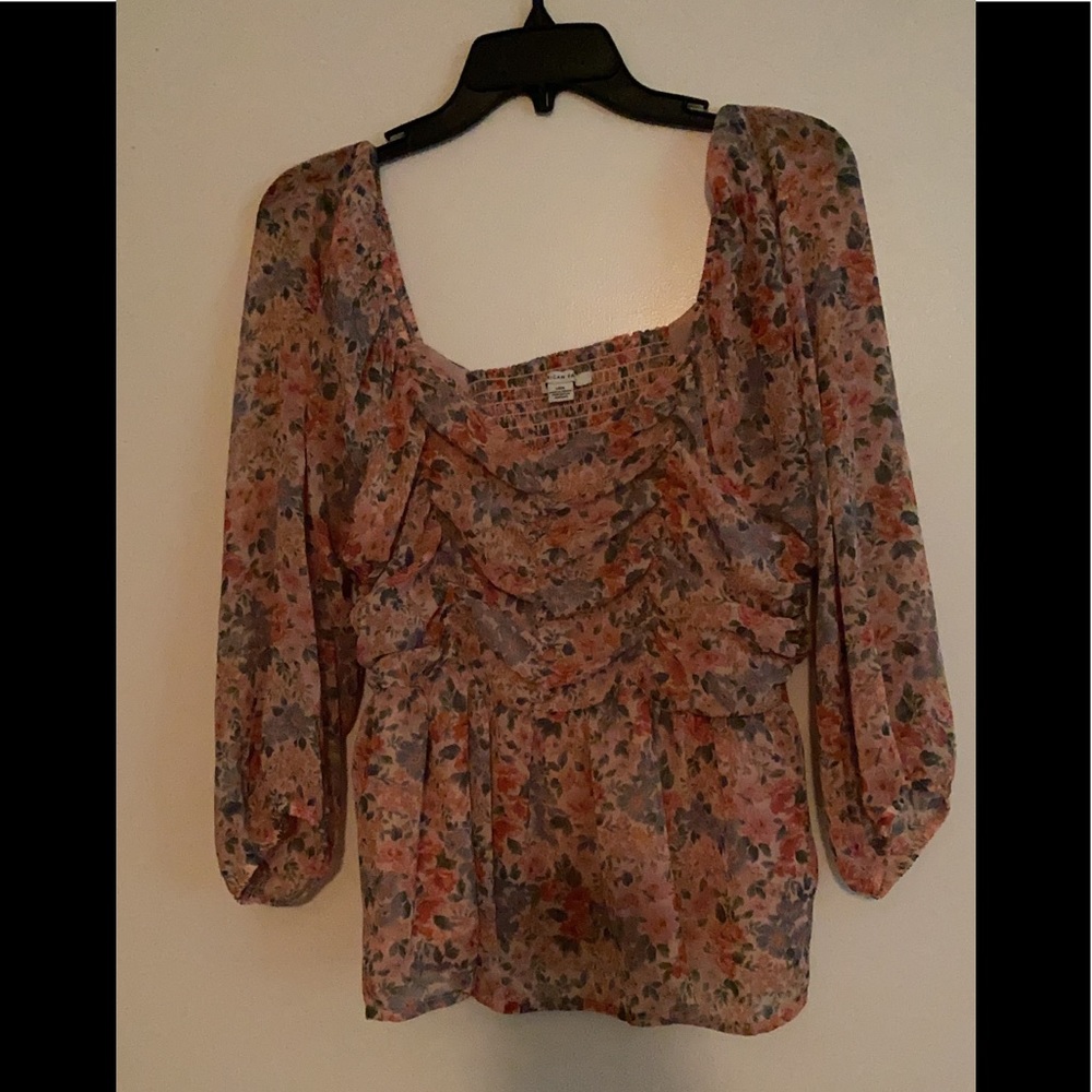 Never worn … light, flowered blouse…